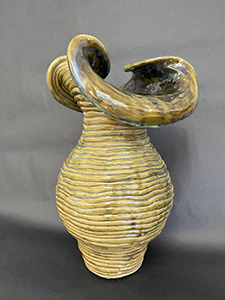Image of Lauren Sunday's red clay and glaze, Coil Vase. 